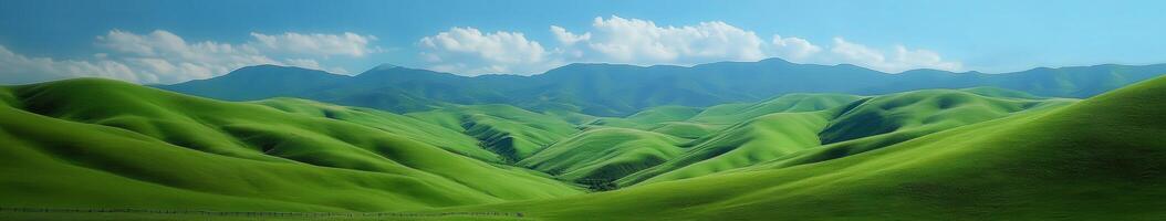 A green landscape with mountains and clouds photo