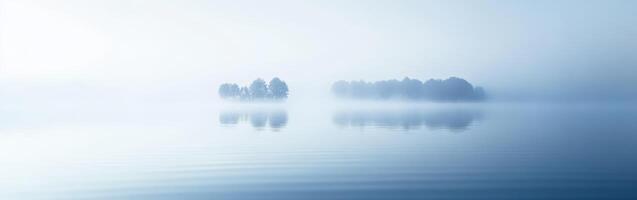 Fog drapes over tranquil lake photo