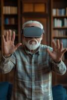 An older man wearing a virtual reality headset photo
