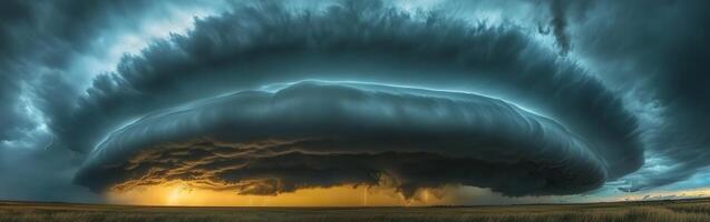 A large storm cloud is seen in the sky photo