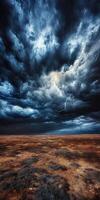 A stormy sky over a barren landscape with dark clouds photo