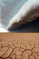 Clouds hover over cracked desert photo
