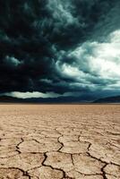 Clouds loom over cracked landscape photo