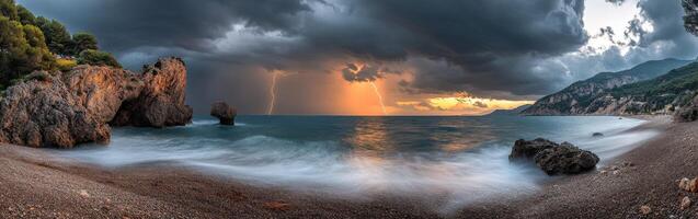 A stormy sunset over the ocean with rocks and water photo