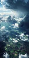 A view of a cloudy sky with a green field photo