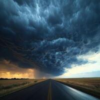 A stormy sky over a road in the middle of nowhere photo