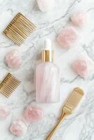 Hair growth serum with rose quartz and styling tools photo