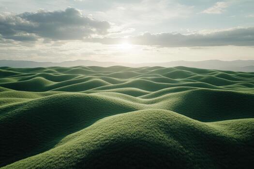 A green field with hills and mountains in the background photo