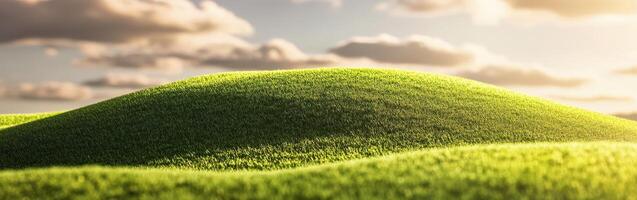 Green grass hill with clouds in the background photo
