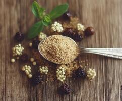 Psyllium husk displayed on a rustic wooden table photo