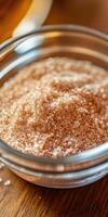 Psyllium husk powder in a glass jar on a wooden table photo