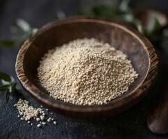 Psyllium husk powder in wooden bowl with herbs photo