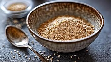 Psyllium powder in a rustic bowl on a dark surface photo