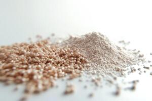 Psyllium powder and husk displayed on white surface photo