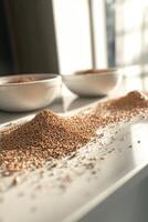 Psyllium husk granules on a bright kitchen surface photo