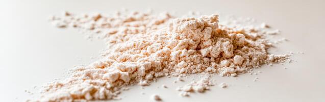 Psyllium husk powder on a clean surface in natural light photo