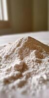 Psyllium husk powder on a table surface at daylight photo