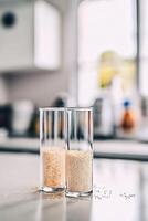 Different forms of psyllium displayed in glass containers photo