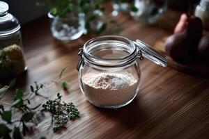 Psyllium husk in a glass jar on a wooden kitchen table photo