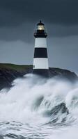 Towering lighthouse amidst stormy waves at dusk photo