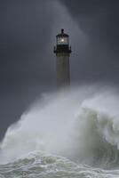 Stormy sea waves crashing near historic lighthouse photo