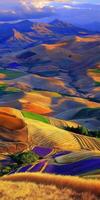 Colorful patchwork fields under a vibrant sky photo