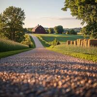 Picturesque gravel road leading to a red barn photo