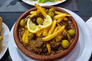 Savory Moroccan Tagine with Olives, Lemon, and Fries for Culinary Enthusiasts photo