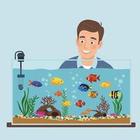 Man Enjoying Colorful Fish in a Freshwater Aquarium at Home vector