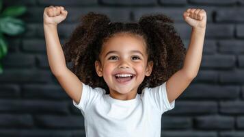 joyful girl celebrating with raised arms, expressing happiness and excitement photo