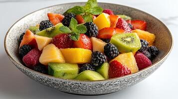Fresh fruit salad in stylish bowl, vibrant colors and healthy mix photo