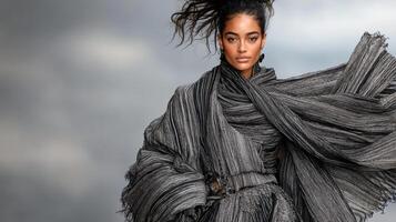 Dramatic layered outfit with elegant pose and flowing fabric in motion photo