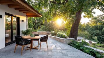 Charming patio with wooden table and chairs, surrounded by greenery photo