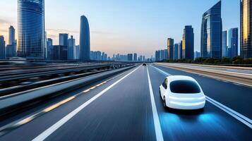 Autonomous vehicle on modern city highway with skyscrapers at sunset photo