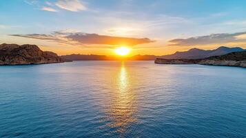 Breathtaking sunset over calm waters, illuminating serene landscape photo