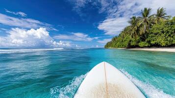 Surfing on clear blue waters with palm trees in background photo