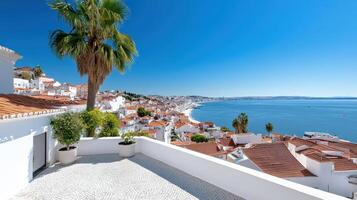 A view of the sea and white houses from a balcony photo