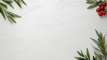 Fresh greenery and red berries on textured white background photo