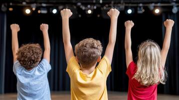 Empowered youth celebrating on stage with raised fists, showcasing unity and joy photo