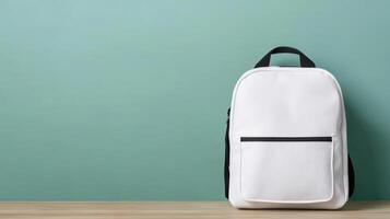 stylish white backpack against mint green background, perfect for daily use photo