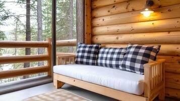Cozy sofa with plaid cushions in rustic cabin surrounded by nature photo