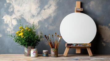 vibrant art studio setup with brushes, paint, and blank canvas photo