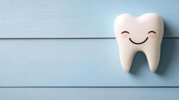 Happy tooth character on blue wooden background, promoting dental health photo