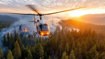 rescue helicopter hovering above forest during wildfire at sunset photo