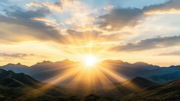 Breathtaking sunset over mountain range with radiant sun rays photo
