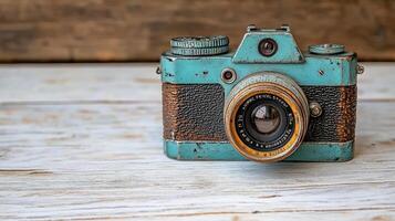 Vintage camera with weathered blue finish and intricate details photo