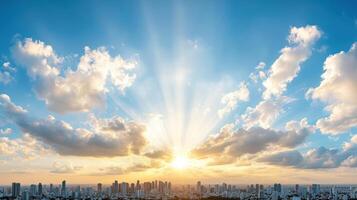Breathtaking sunset with rays of light over city skyline and clouds photo