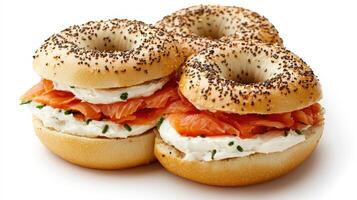 Classic bagels with cream cheese and smoked salmon stacked together photo