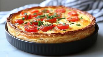 delicious breakfast quiche with golden crust and fresh tomatoes photo