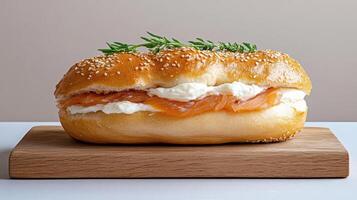 classic bagel with cream cheese and smoked salmon, garnished with herbs photo